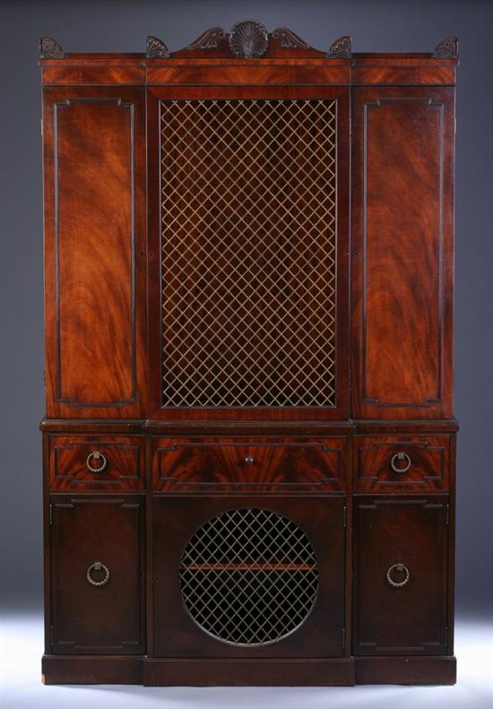 Appraisal: REGENCY STYLE MAHOGANY BREAKFRONT SECRETARY CABINET th century with grilled-panel