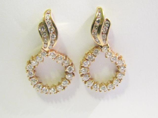 Appraisal: A pair of K yellow gold earrings each with twenty-seven