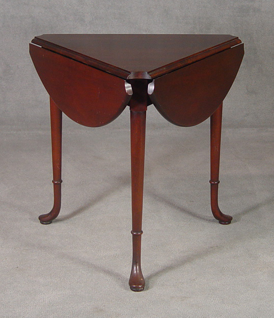 Appraisal: Walnut Handkerchief Table Mid th Century Triangular drop leaf top