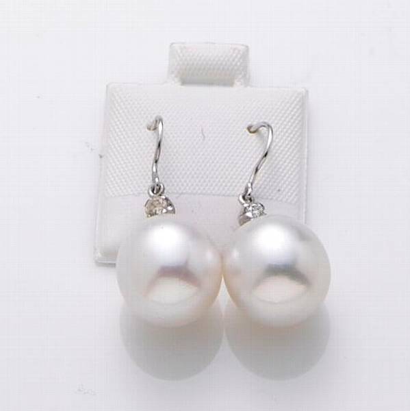 Appraisal: A pair of off-white South Sea cultured pearl diamond and