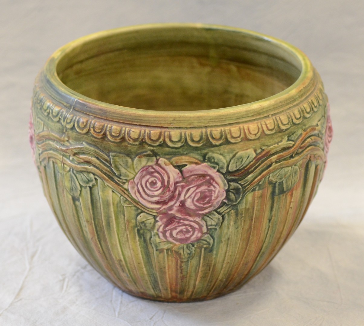 Appraisal: Unsigned Weller Pottery Chelsea jardiniere with roses swags h x