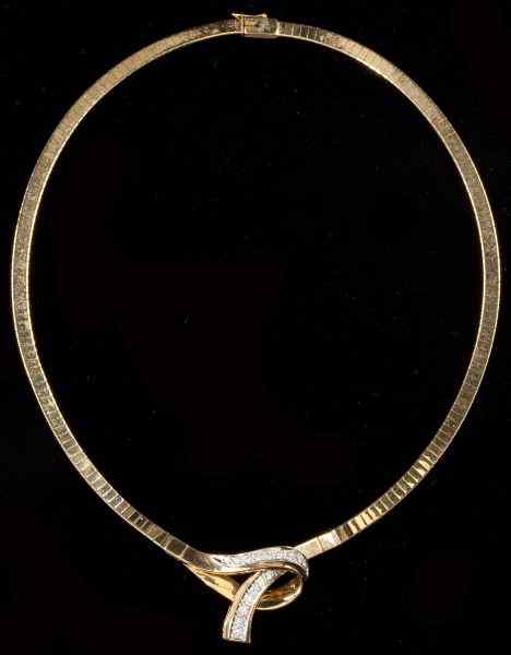 Appraisal: Gold and Diamond Necklacecomposed of a yellow gold Omega chain