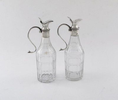 Appraisal: Two George III silver mounted oil bottles beaded scroll handles