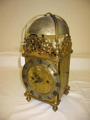 Appraisal: A BRASS LANTERN CLOCK the twin fusee movement with rack