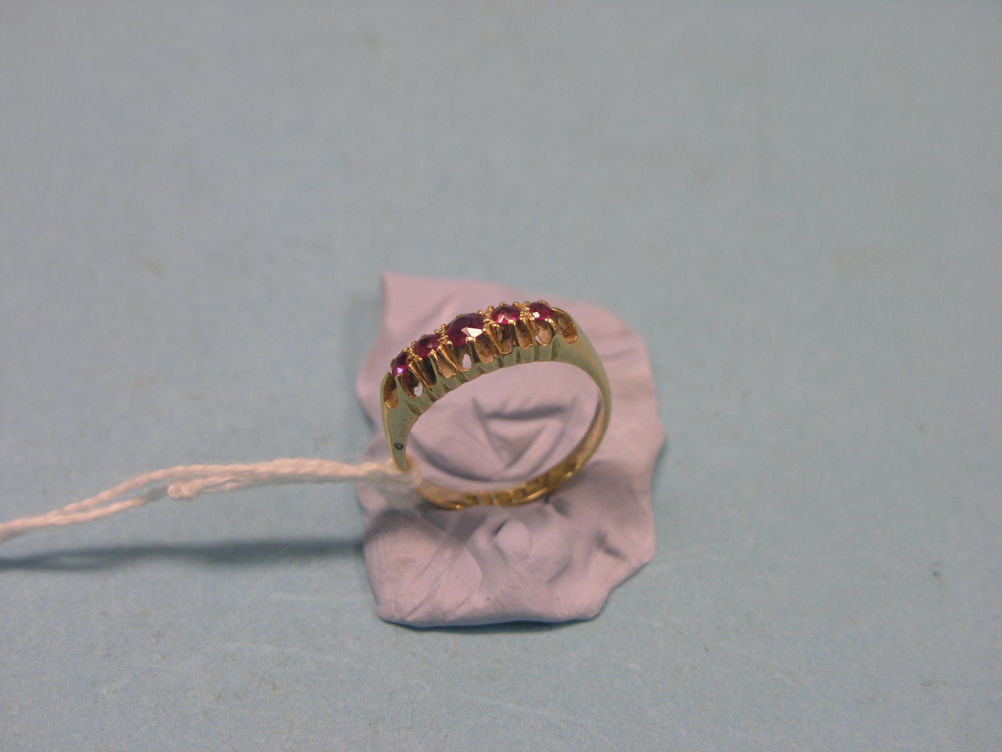 Appraisal: An ct gold half-hoop ring five graduated rubies in claw