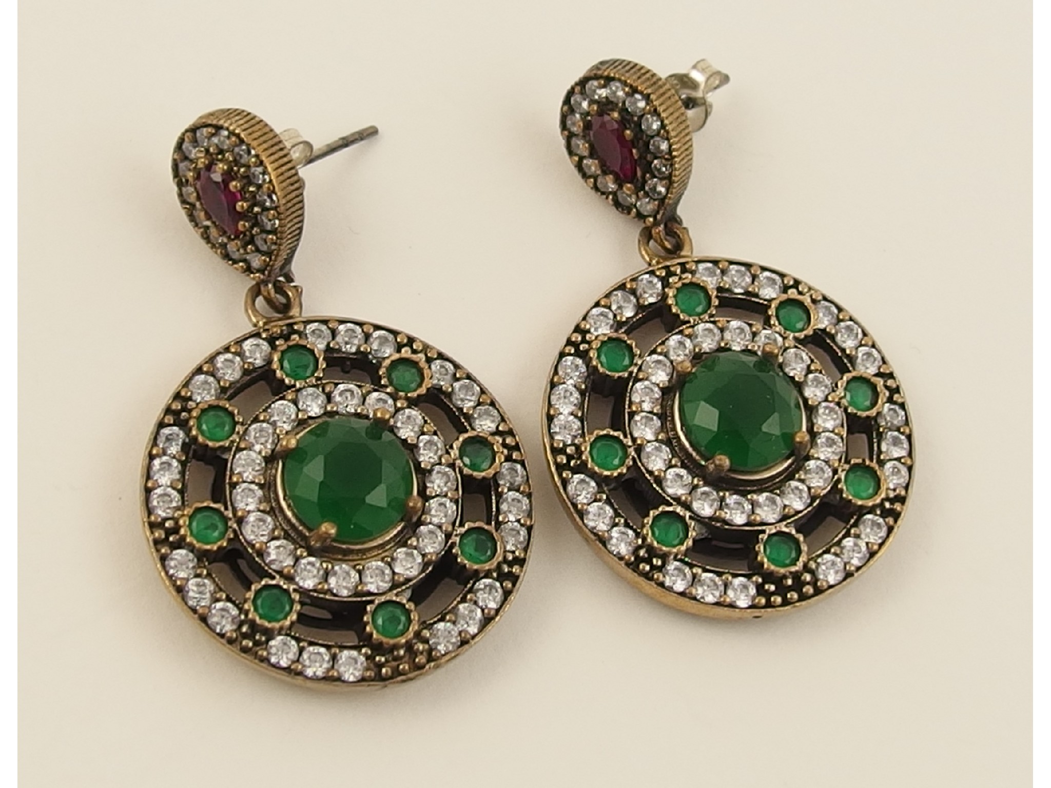 Appraisal: A pair of silver emerald ruby and white topaz earrings