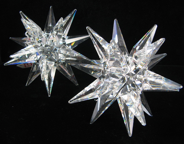 Appraisal: PAIR AUSTRIAN SWAROVSKI CRYSTAL CANDLEHOLDERS Large Star design clear cut