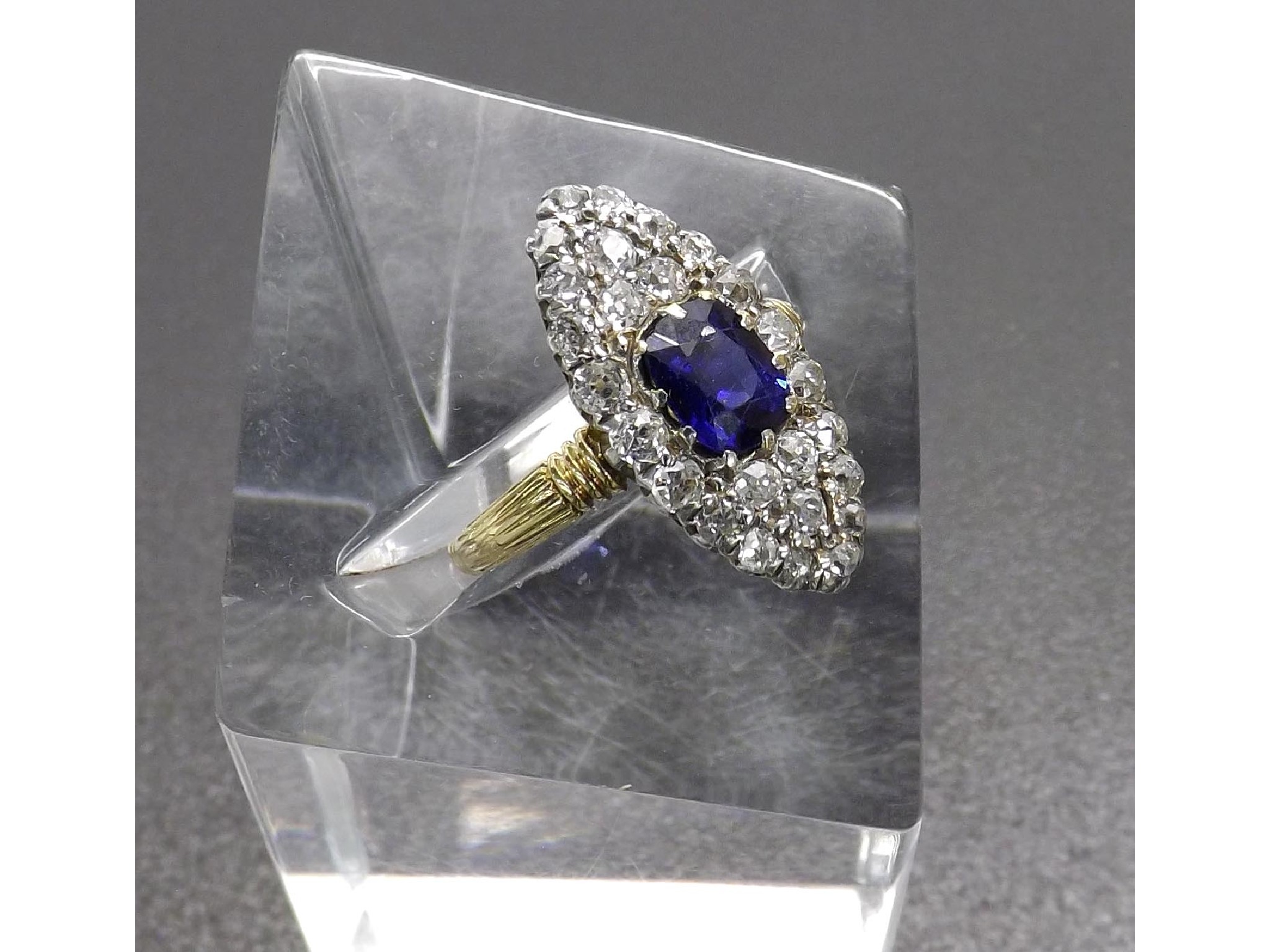 Appraisal: Good sapphire and diamond marquise cluster ring the oval-cut natural