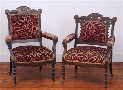 Appraisal: TWO EASTLAKE INCISED WALNUT ARMCHAIRS Each with shaped pierced crest