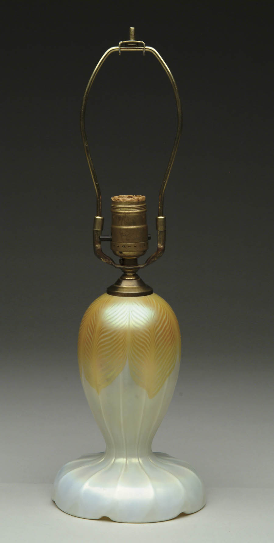 Appraisal: ART GLASS LAMP BASE Attributed to Steuben features gold pulled-feather