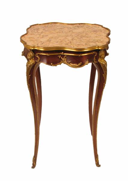 Appraisal: A Louis XV style gilt bronze mounted marble top table