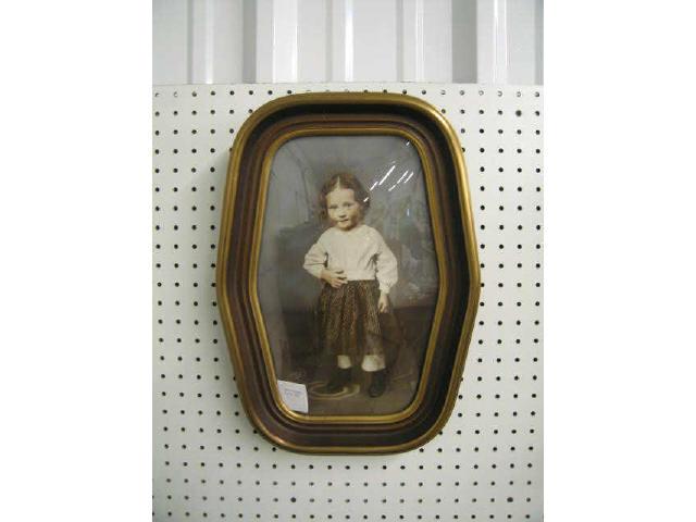 Appraisal: Vintage Hand Tinted Photograph of a Child convex deco frame