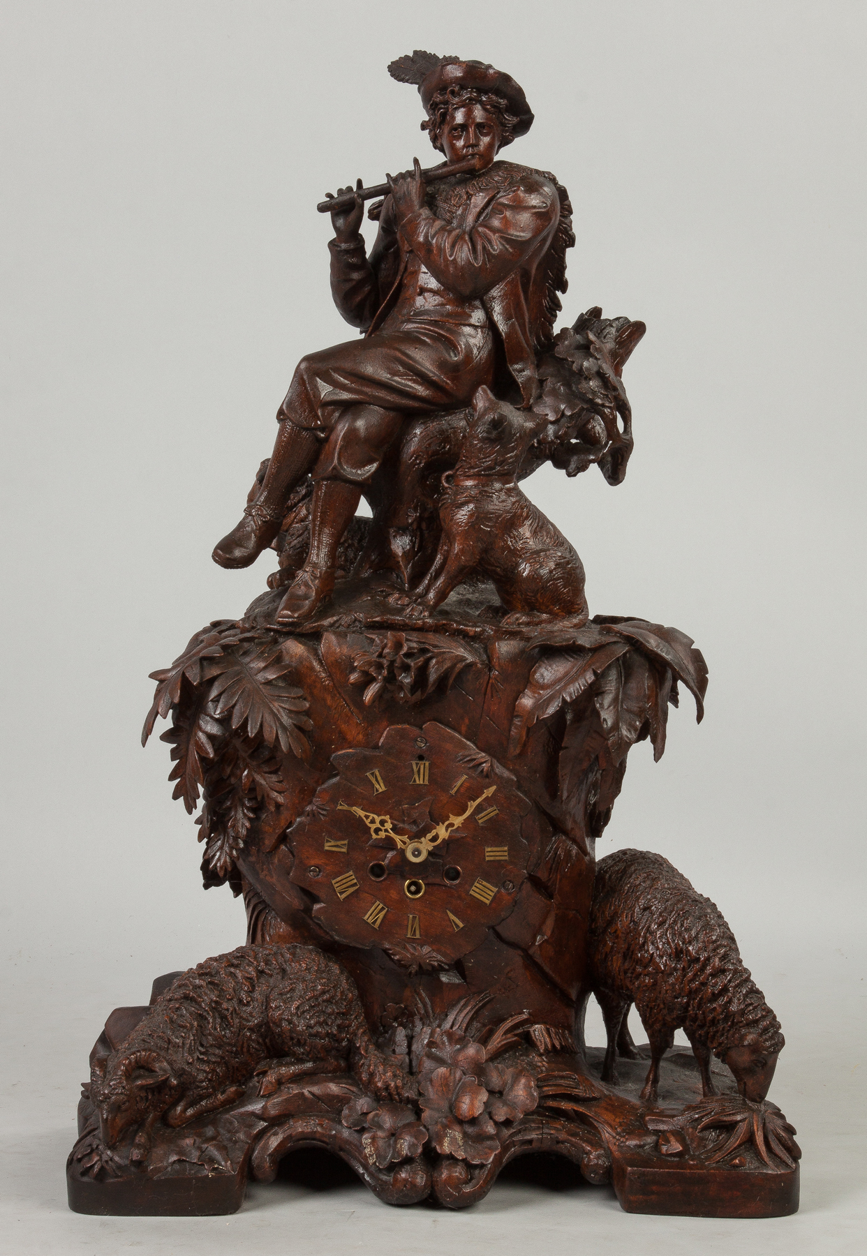 Appraisal: Carved Black Forest Clock with Figure Playing Flute Dogs and