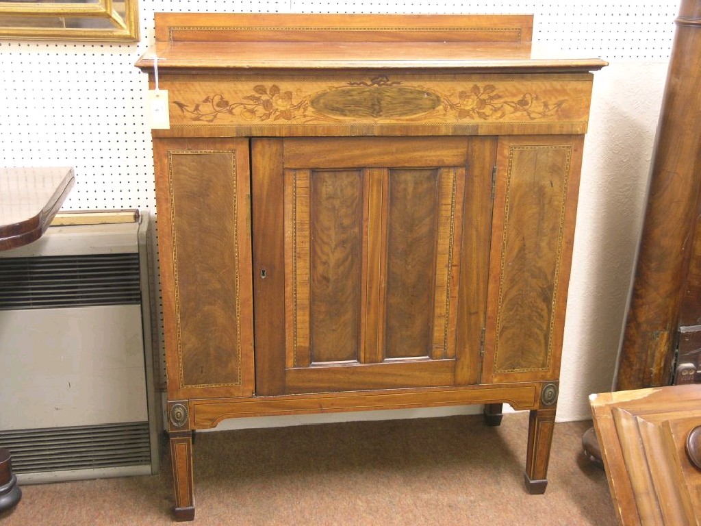 Appraisal: An early th century Dutch inlaid mahogany side cupboard frieze