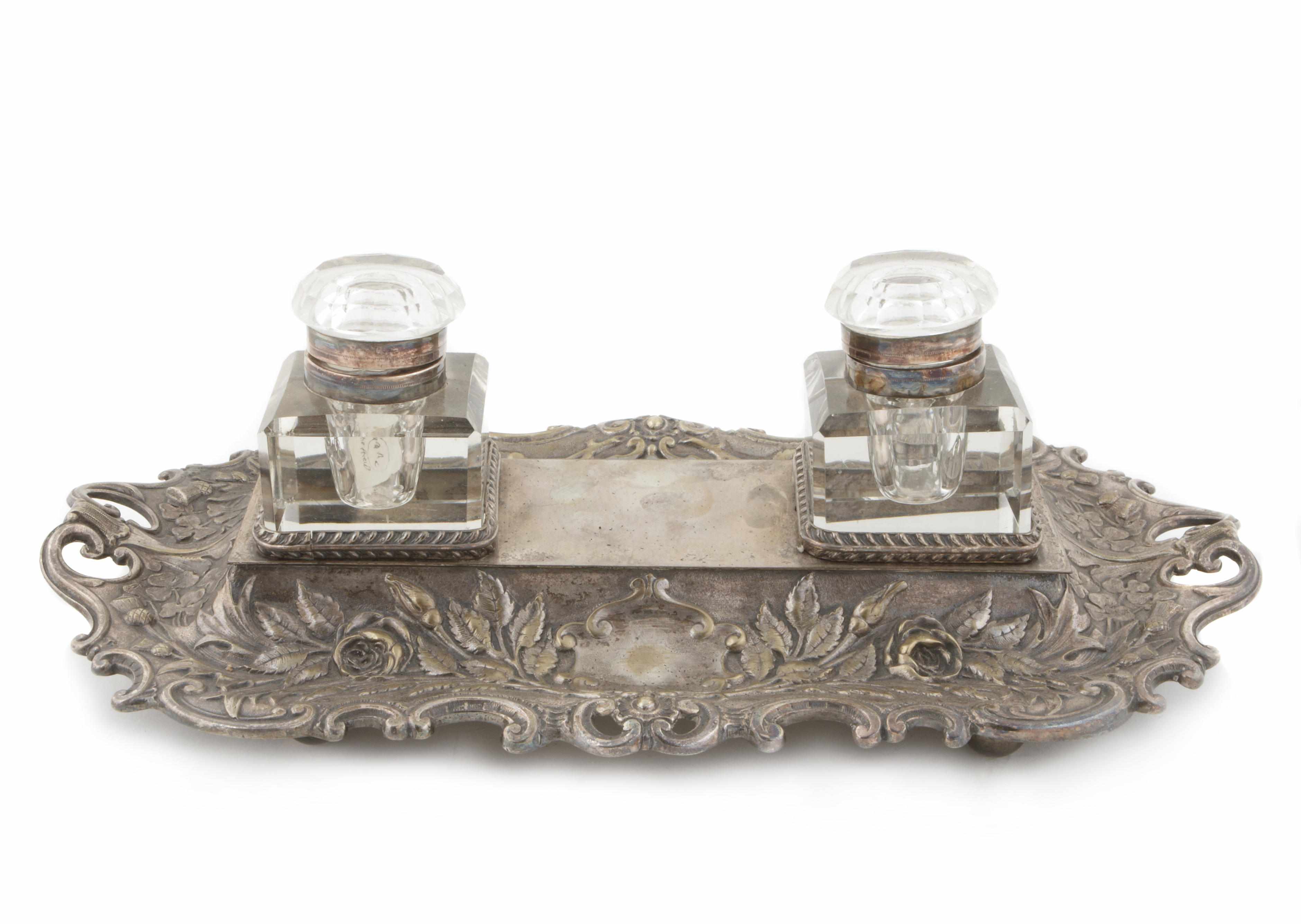 Appraisal: An English Victorian silver plated desk stand fitted with two