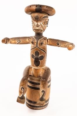 Appraisal: A carved and painted tribal figure modelled with arms outstretched