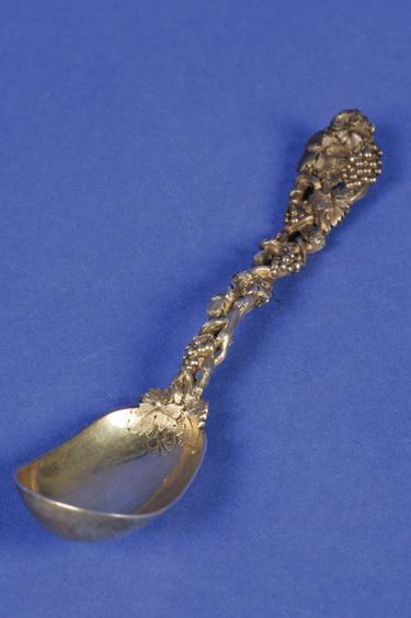 Appraisal: A VICTORIAN SILVER GILT SUGAR SPOON with a cast vine