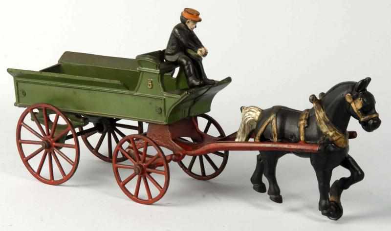 Appraisal: Cast Iron Kenton Horse-Drawn Dray Wagon Toy Description Includes seated