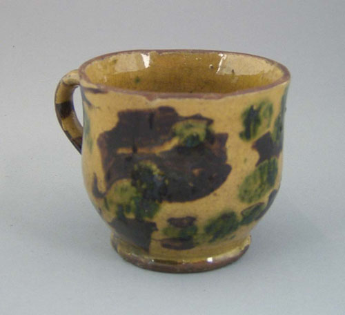 Appraisal: Pennsylvania redware mug th c with brown and green splotch