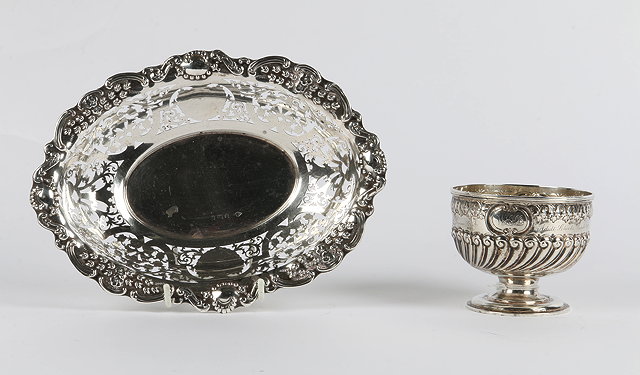 Appraisal: A SILVER PIERCED AND CHASED BASKET of oval form marks