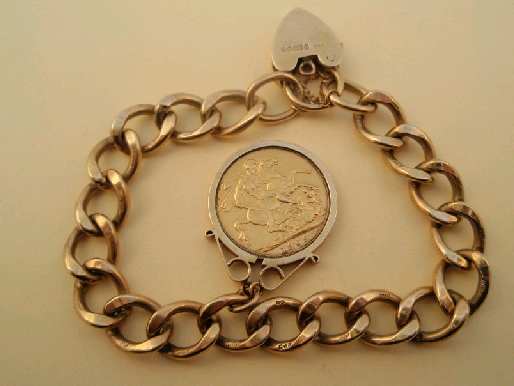 Appraisal: A ct gold heavy curb link bracelet with full sovereign