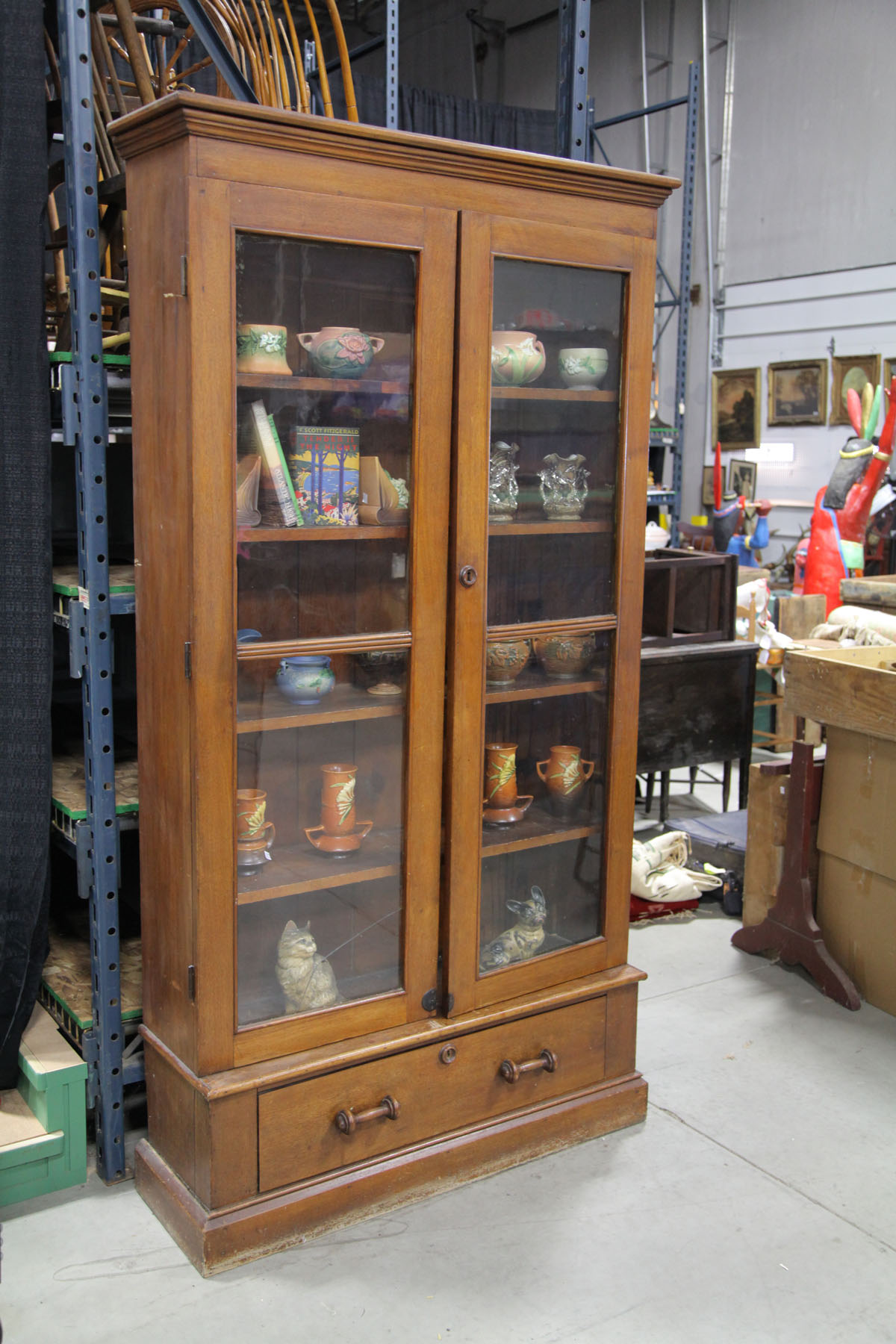 Appraisal: BOOKCASE American late th century walnut Stepped cornice two double