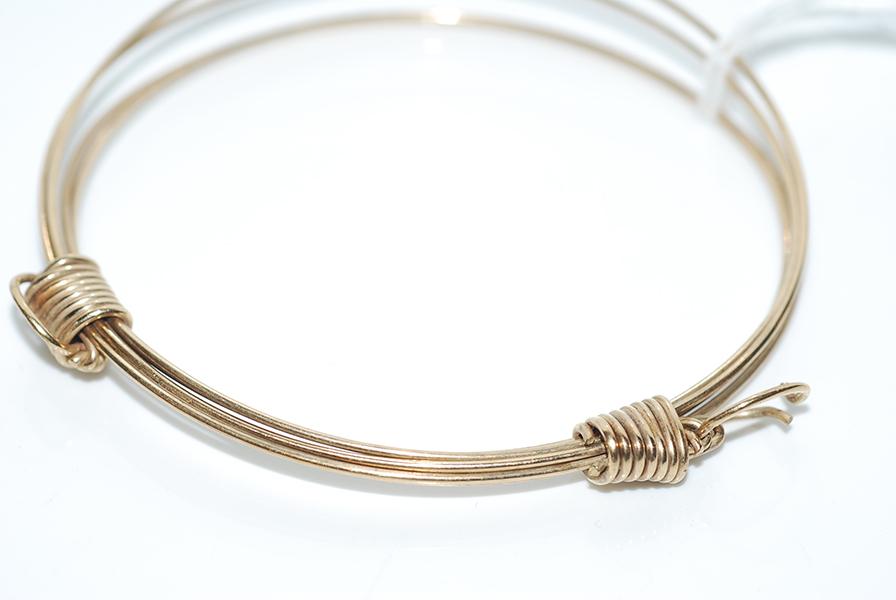 Appraisal: A MULTI STRAND BANGLE IN CT GOLD A MULTI STRAND