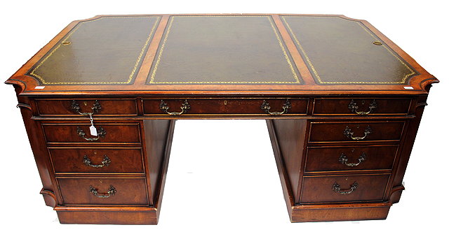 Appraisal: A GEORGIAN STYLE WALNUT VANEERED PARTNERS PEDESTAL DESK with triple