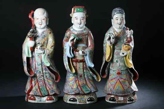 Appraisal: THREE CHINESE FAMILLE ROSE PORCELAIN FIGURES OF IMMORTALS Qing Dynasty