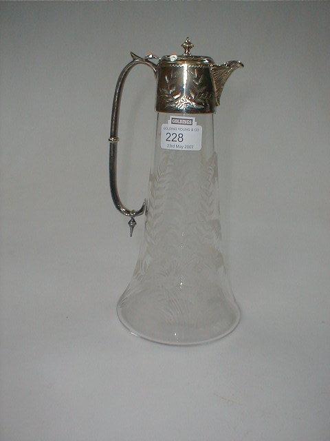 Appraisal: An Edwardian claret jug with wheel cut fern decorated body