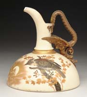 Appraisal: DECORATED PORCELAIN EWER Enameled bird decoration in colors of gold