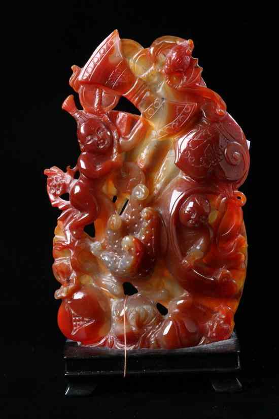 Appraisal: CHINESE CARNELIAN CARVING OF A FAN Carved in high relief