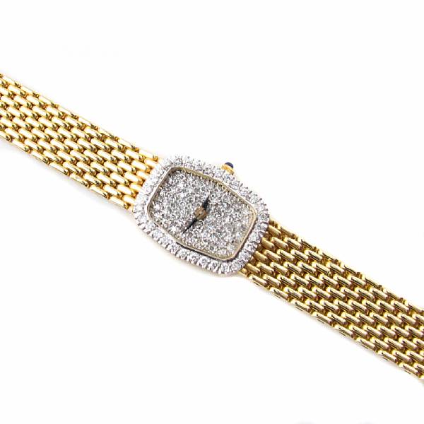 Appraisal: A lady's diamond and fourteen karat gold bracelet wristwatch tonneau