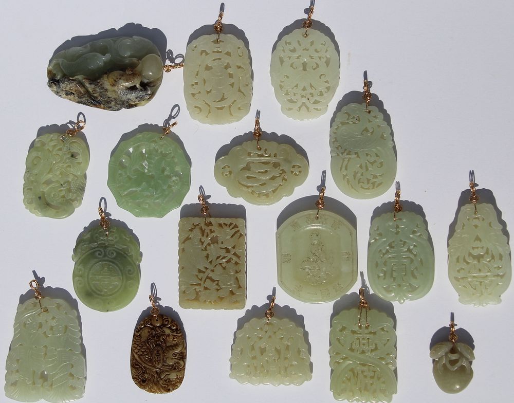 Appraisal: Carved Chinese Jade Pendants Carved Chinese Jade Pendants with gold