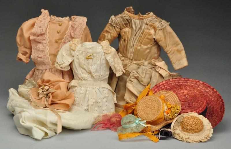 Appraisal: Lot of Vintage Doll Clothes Hats Description Antique silk dress