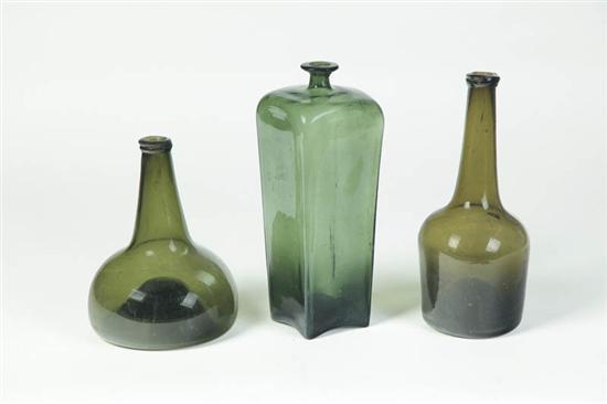 Appraisal: THREE BOTTLES England th century Blown olive green glass Pictured