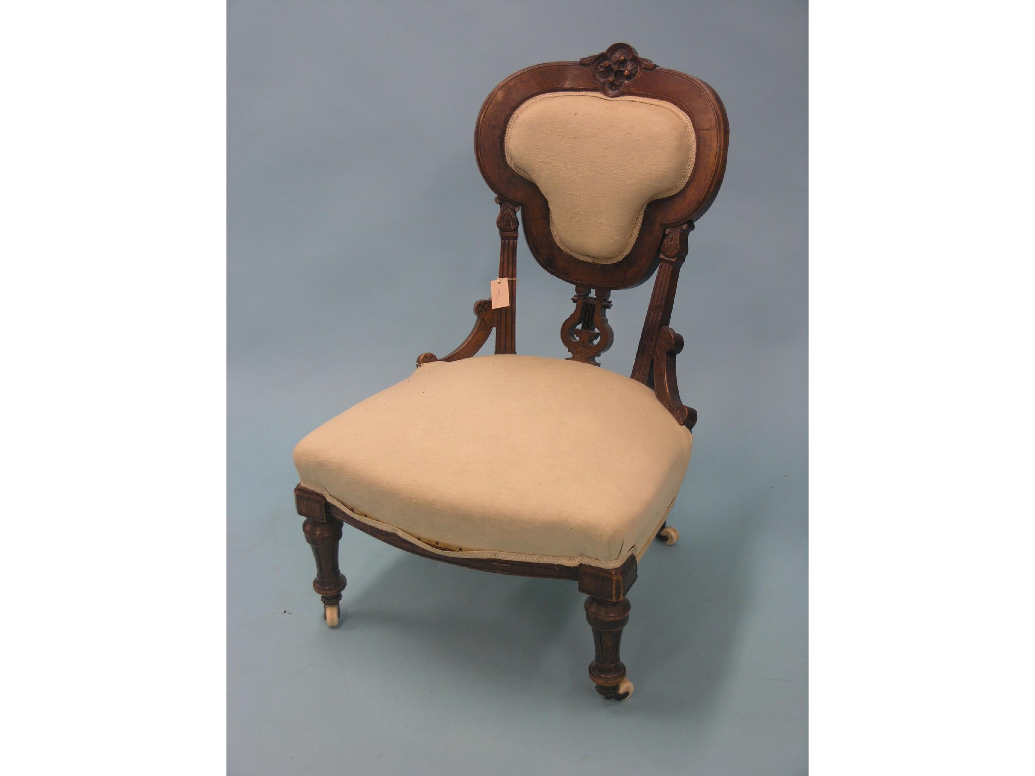 Appraisal: A Victorian walnut drawing room chair carved detail including lyre