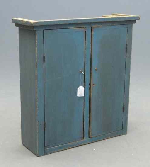 Appraisal: th c New England two door hanging cupboard in robins