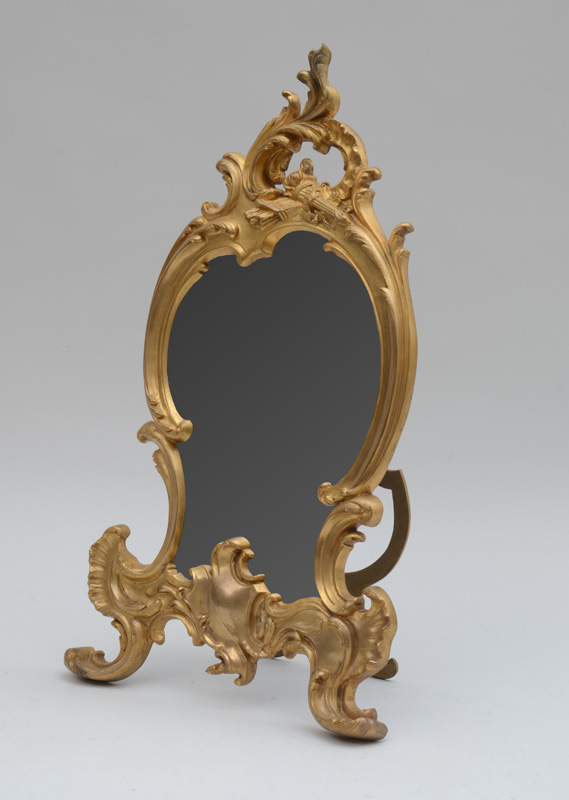 Appraisal: LOUIS XV STYLE GILT-BRONZE DRESSING TABLE MIRROR The shaped frame