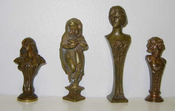 Appraisal: FOUR AUSTRIAN CAST BRONZE FIGURAL SEALS Each with female or