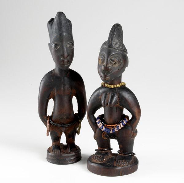 Appraisal: YORUBA IBEJI TWIN FIGURES Nigeria Africa Carved wooden dolls representative