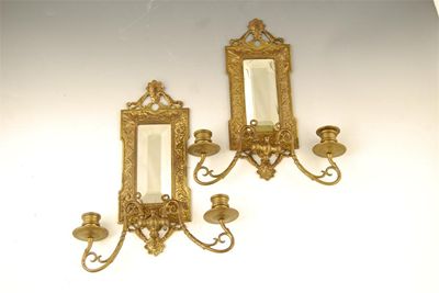 Appraisal: A pair of late Victorian cast brass girandoles with bevelled