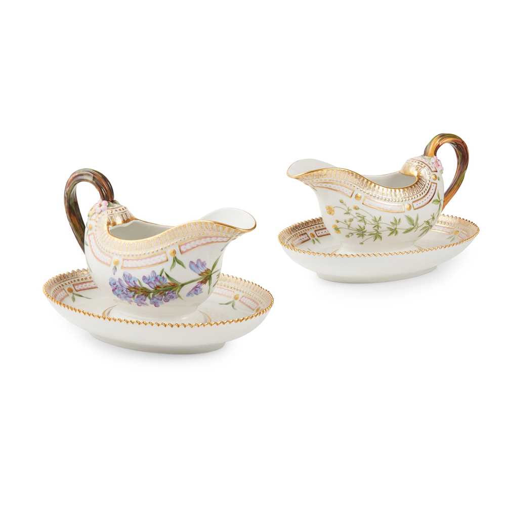 Appraisal: TWO ROYAL COPENHAGEN 'FLORA DANICA' SAUCE BOATS ON FIXED STANDS