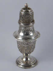 Appraisal: An embossed silver caster with flame finial Birmingham weighted ht