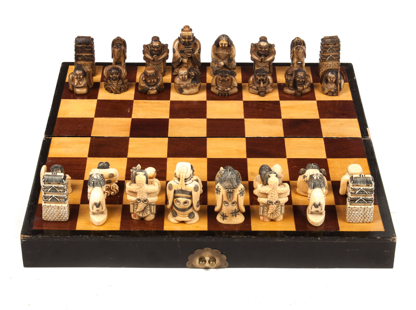 Appraisal: Japanese carved ivory chess set carved ivory netsuke figures acting