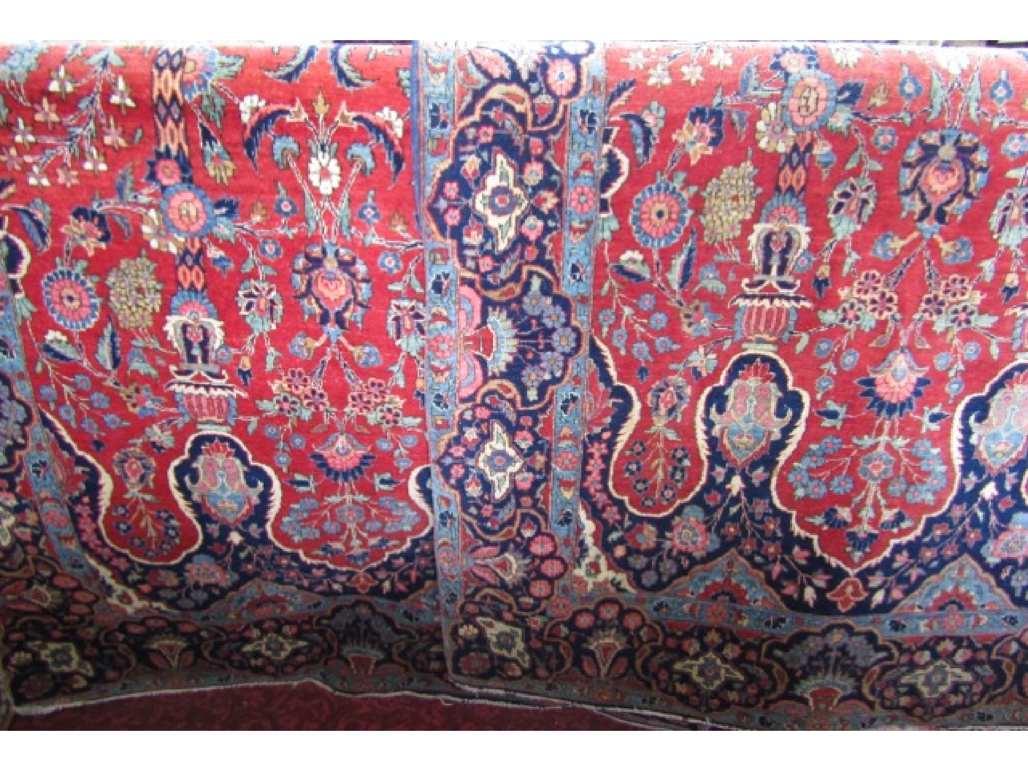 Appraisal: A pair of good quality Persian rugs with red ground