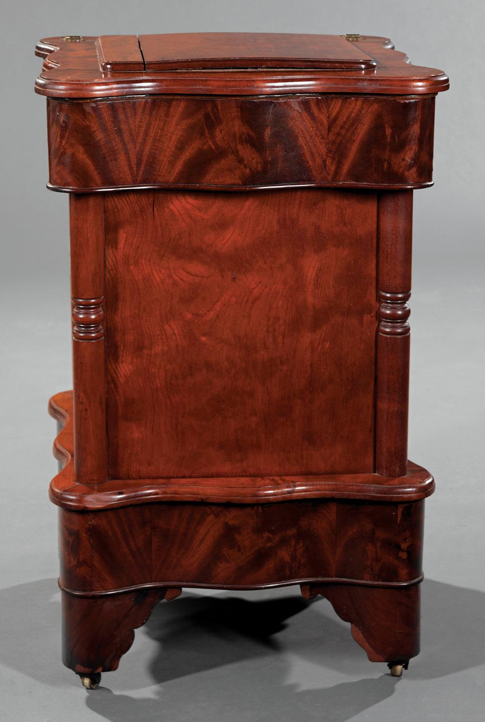 Appraisal: American Late Classical Carved Mahogany Commode th c serpentine hinged