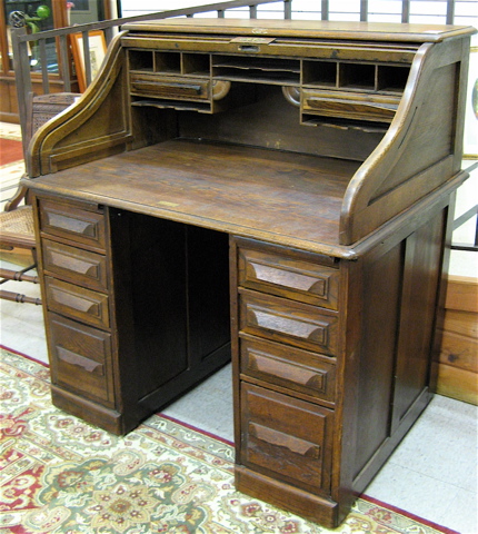 Appraisal: AN OAK ROLL-TOP DESK Cutler Desk Co Buffalo New York