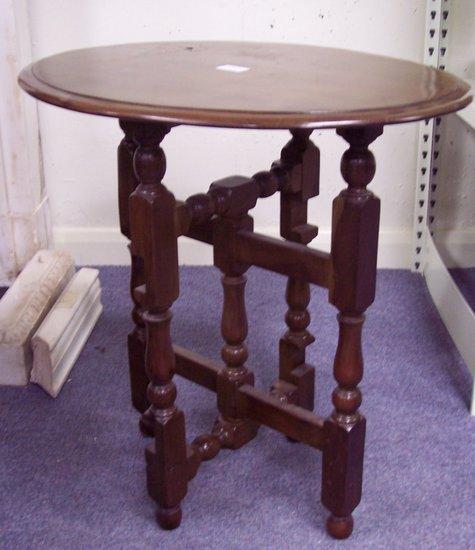 Appraisal: A mahogany table on baluster supports cm wide