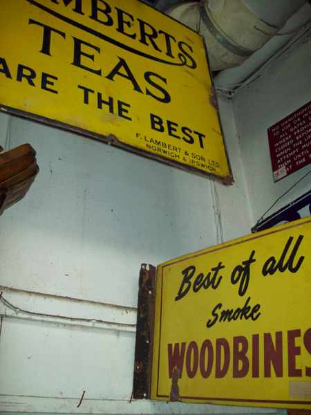 Appraisal: AN ANTIQUE ENAMEL SIGN 'LAMBERTS TEA' AND A 'WOODBINES' SIGN